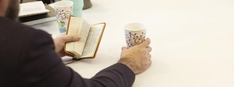 Man reading his Bible at Harvest Desoto Church.