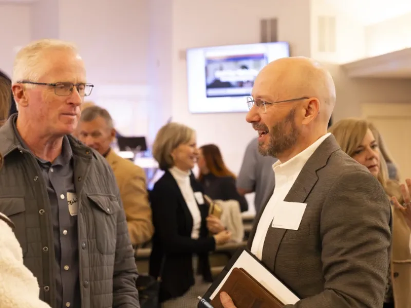 Men talking at Harvest Desoto.